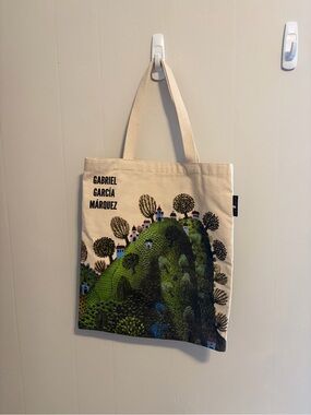 Out of Print Beige Tote with Green Hill Illustration